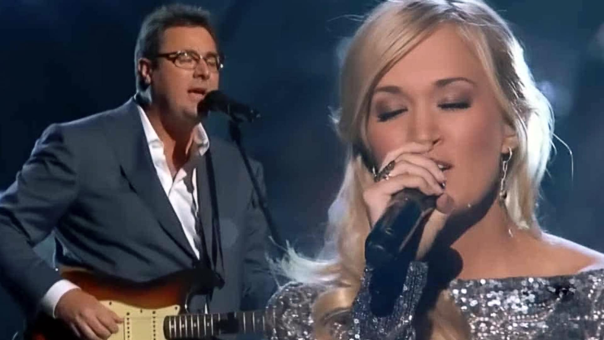 Carrie Underwood and Vince Gill deliver a breathtaking duet of “How Great Thou Art,” with Carrie in a shimmering gown and Vince on guitar, both lost in the reverence of the moment.