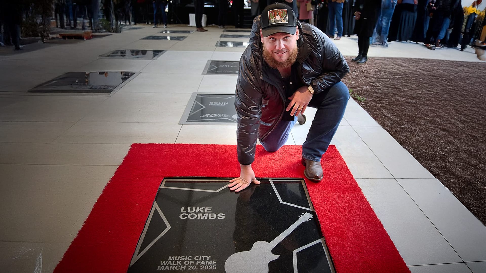 Luke Combs stands over his Music City Walk of Fame star in disbelief, honored and humbled by the city that made his country dreams real.