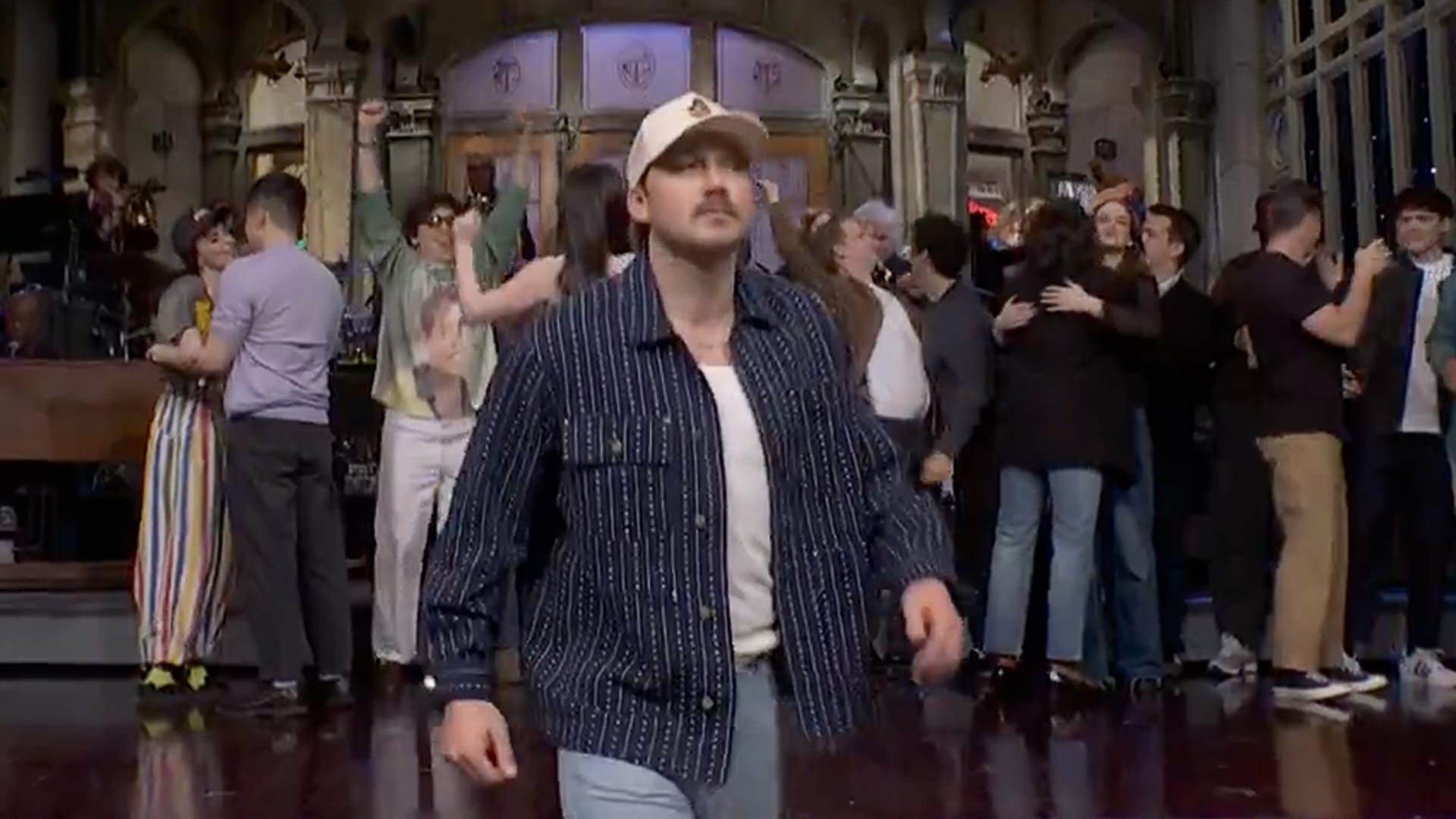 SNL writer throws subtle shade at Morgan Wallen after his abrupt exit, referencing his post-show airport photo with a Krispy Kreme jab.