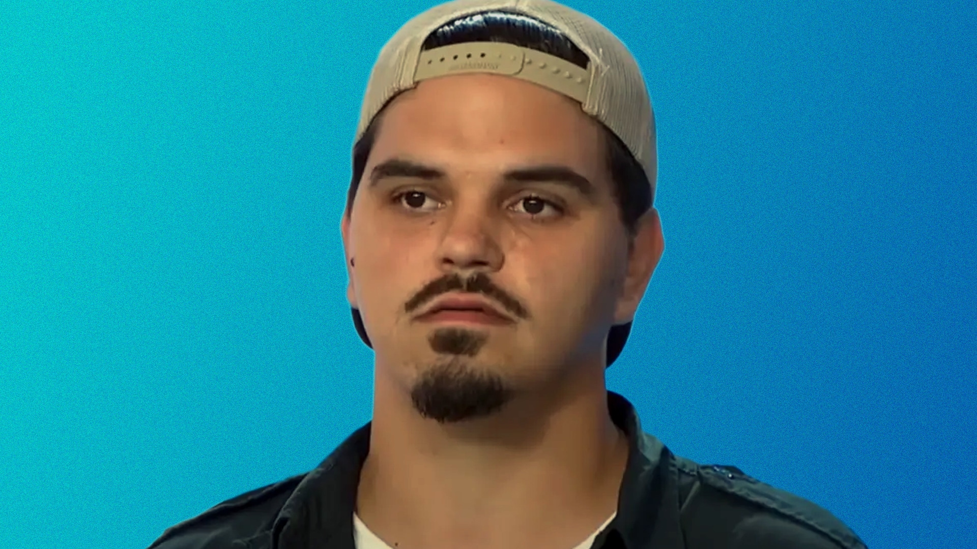 Doug Kiker, known as "The Singing Garbage Man" from American Idol, appears emotional against a blue backdrop—his expression now echoing the heartbreak of his recently revealed cause of death.