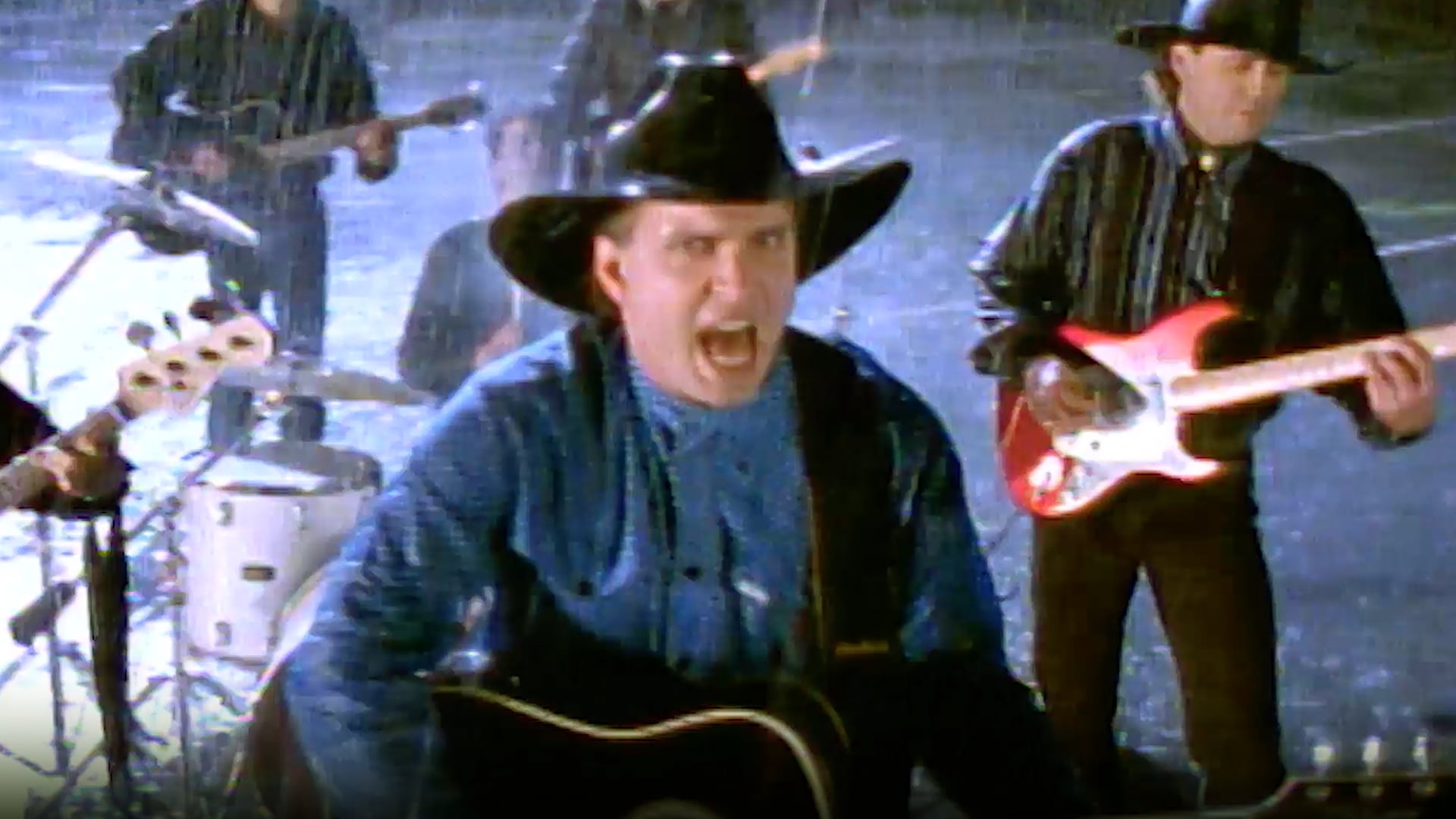 Garth Brooks passionately performs in the rain-soaked 1991 music video for “The Thunder Rolls,” newly reuploaded in HD without edits despite its original ban.