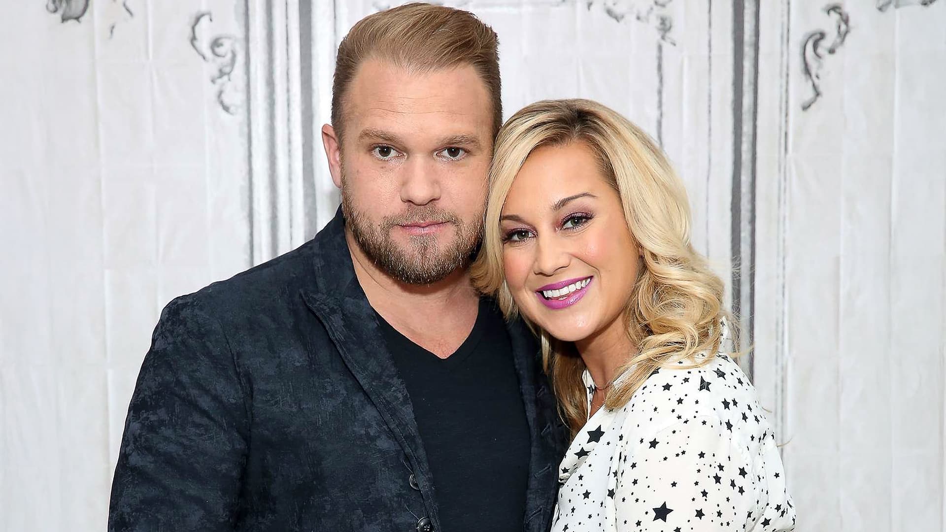 Kellie Pickler stands beside her late husband, songwriter Kyle Jacobs, smiling together before their tragic family dispute made headlines.