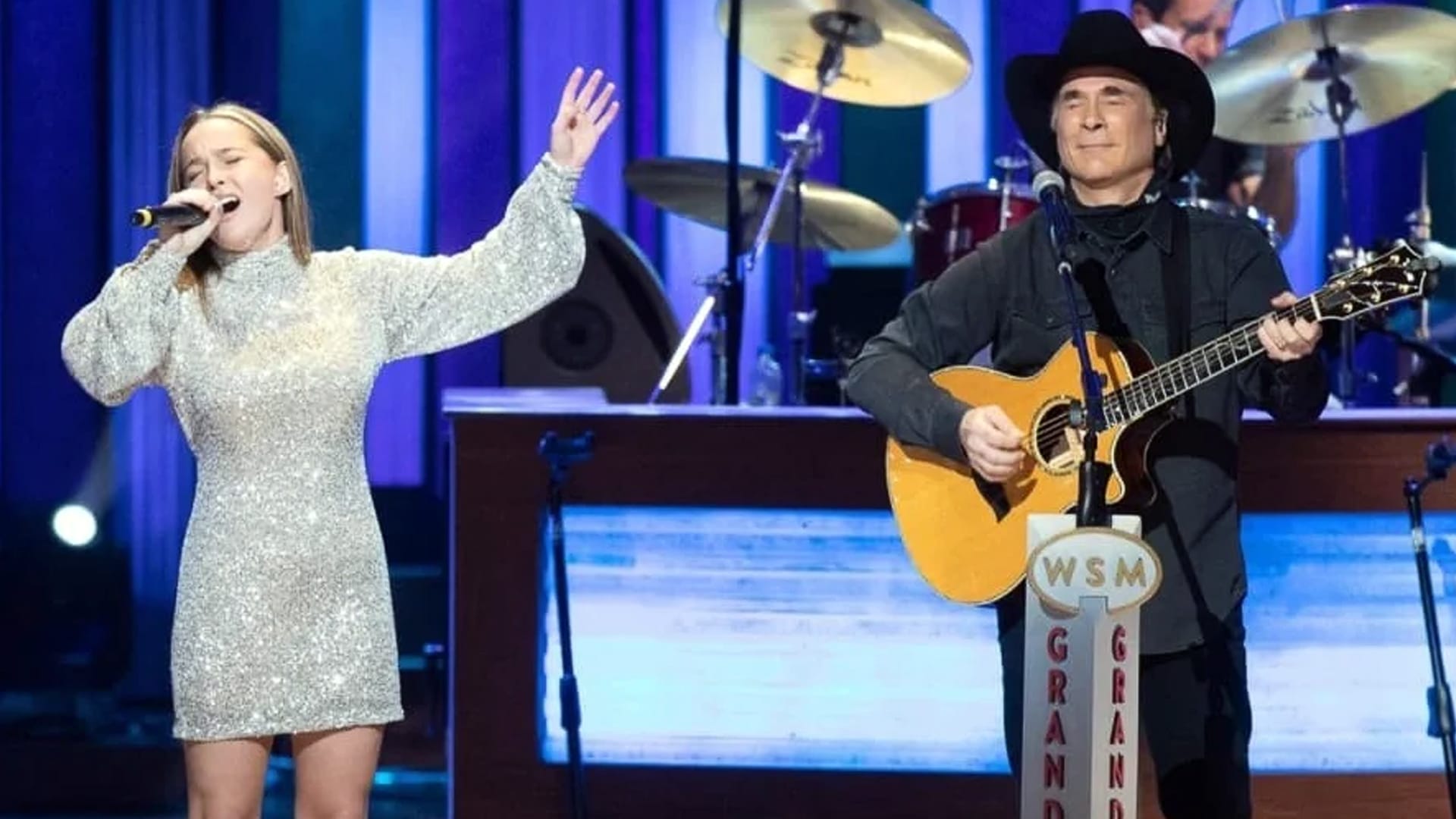 Lily Pearl Black sings beside her father, country music legend Clint Black, during a live Grand Ole Opry performance.