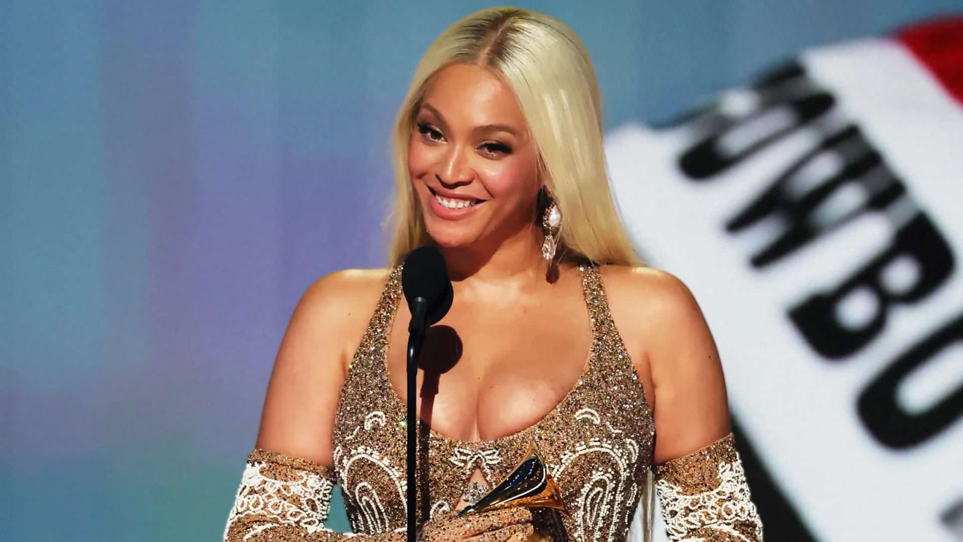 Beyoncé smiles despite controversy over her AMA country nominations that overlooked Cody Johnson and Miranda Lambert.