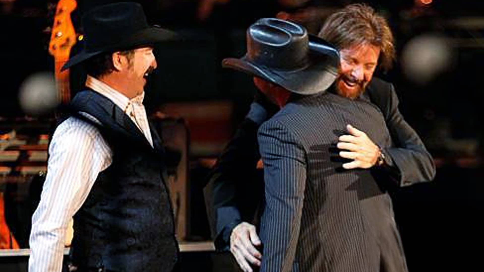 Tim McGraw shares an emotional hug with Brooks & Dunn after delivering a powerful tribute performance of "That Ain't No Way to Go" at The Last Rodeo.