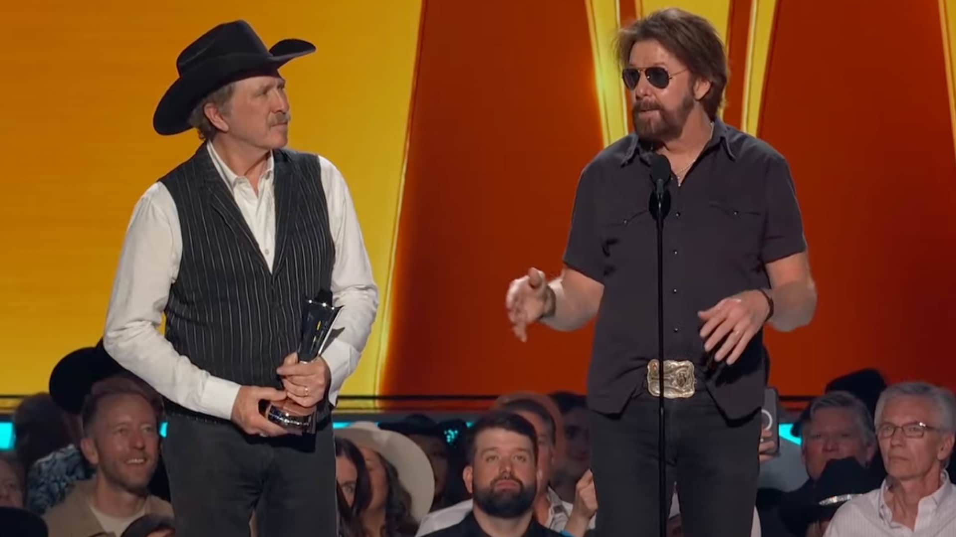 Brooks & Dunn accept the Duo of the Year award at the 2025 ACM Awards, standing together on stage with trophies in hand as they thank fans for decades of support.