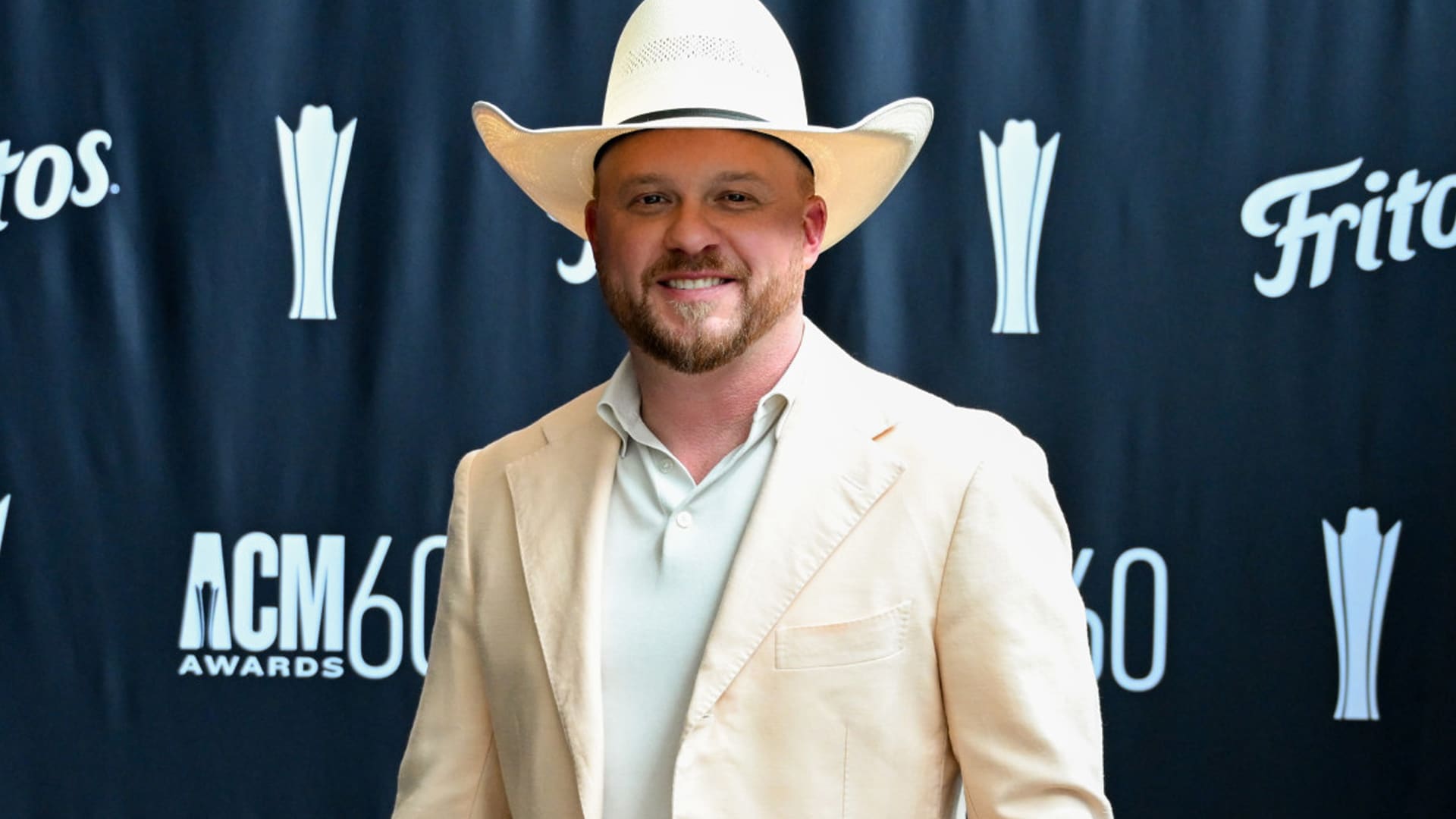 Cody Johnson smiles on the ACM Awards 60th anniversary red carpet after winning Song of the Year for "Dirt Cheap."