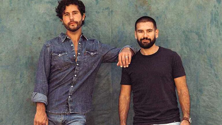Dan + Shay pose in a throwback photo as they win 2025 AMAs Country Duo of the Year without performing.