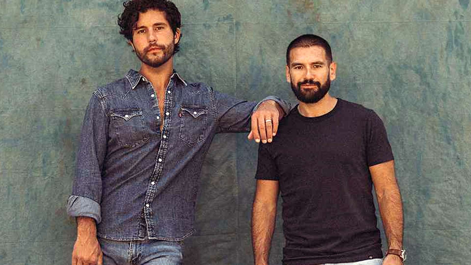 Dan + Shay pose in a throwback photo as they win 2025 AMAs Country Duo of the Year without performing.