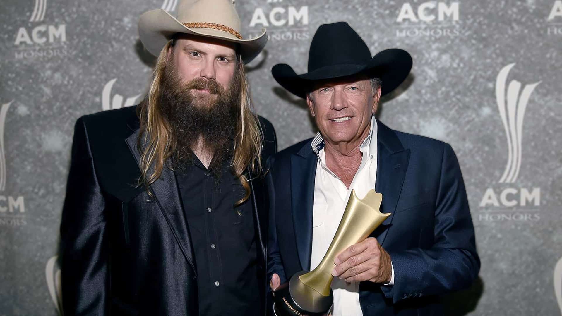 Chris Stapleton stands beside George Strait at the ACM Honors, as Strait holds his trophy—symbolizing the very legacy Stapleton is now one award away from surpassing at the 2025 ACMs.