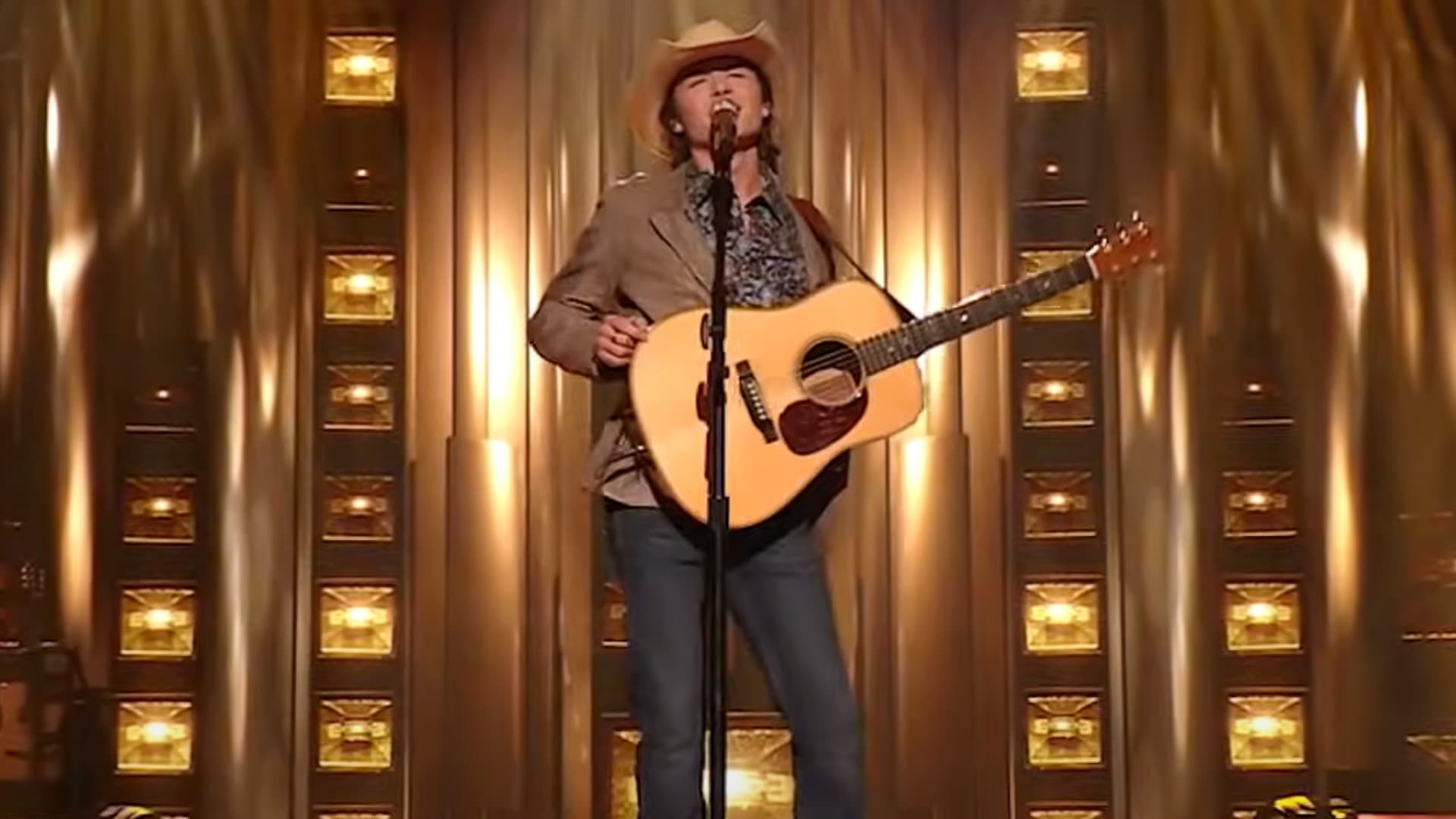 John Foster performs Bonnie Raitt’s “Something to Talk About” on American Idol, winning over judges and fans as he secures a spot in the Top 8.