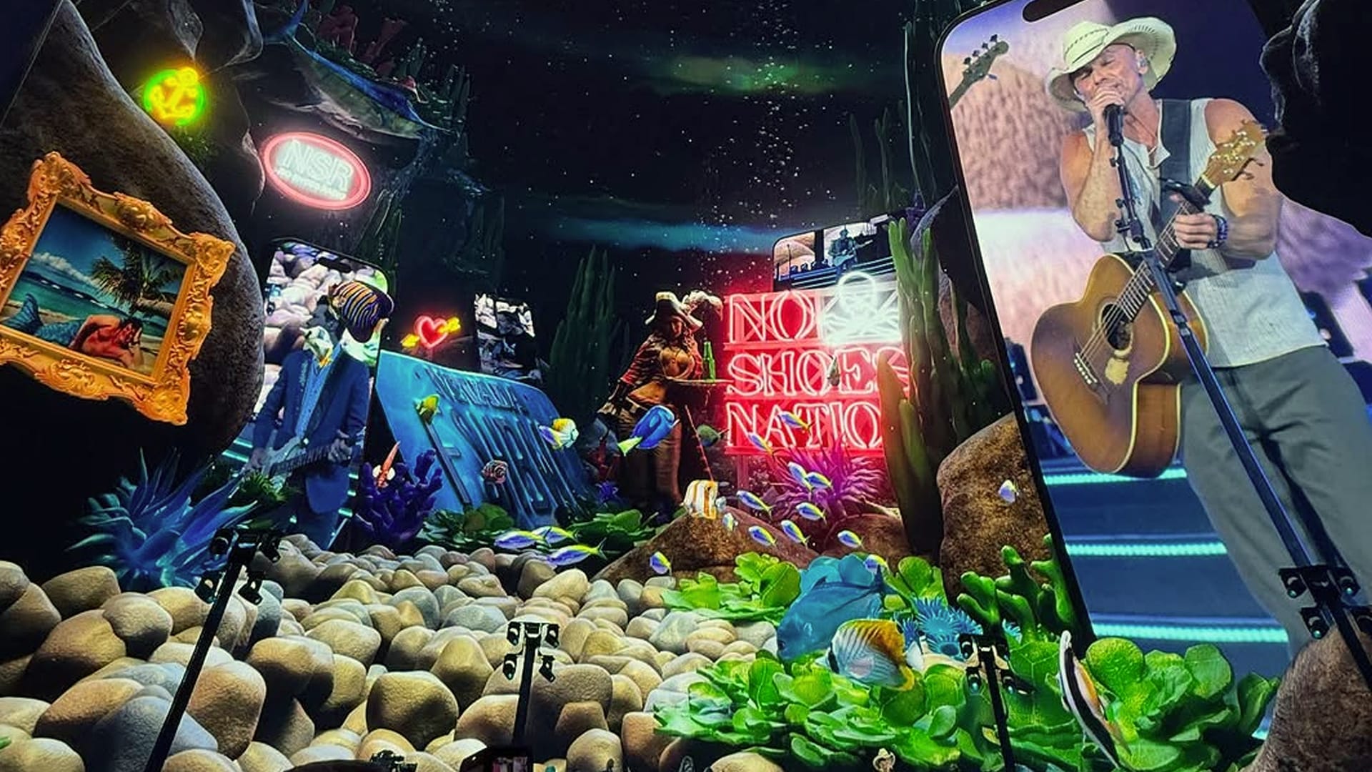 Kenny Chesney performs inside the Las Vegas Sphere surrounded by neon lights, tropical visuals, and underwater beach bar-themed projections celebrating his historic country concert.