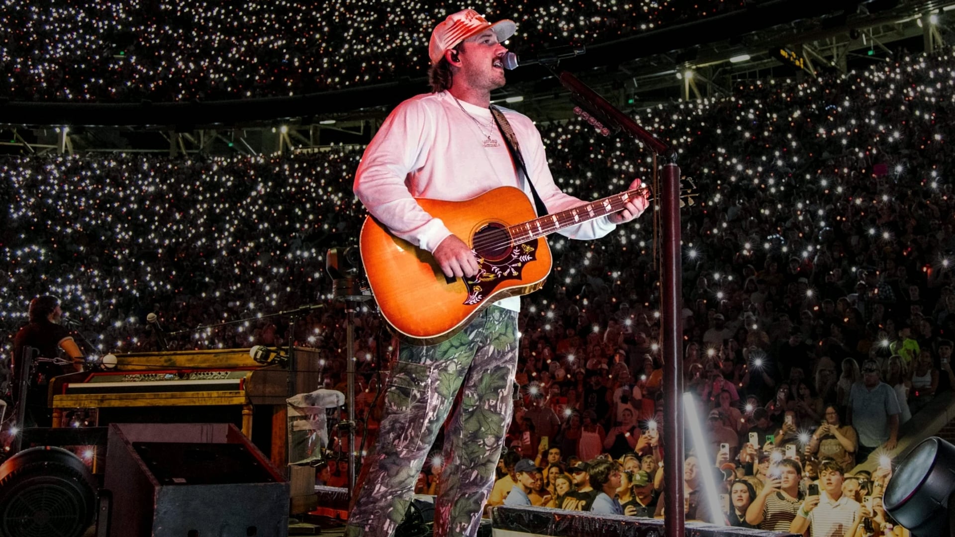 Morgan Wallen performs for a packed stadium crowd in an earlier concert moment—just months before his ACM Awards shutout sparked major fan backlash in 2025.