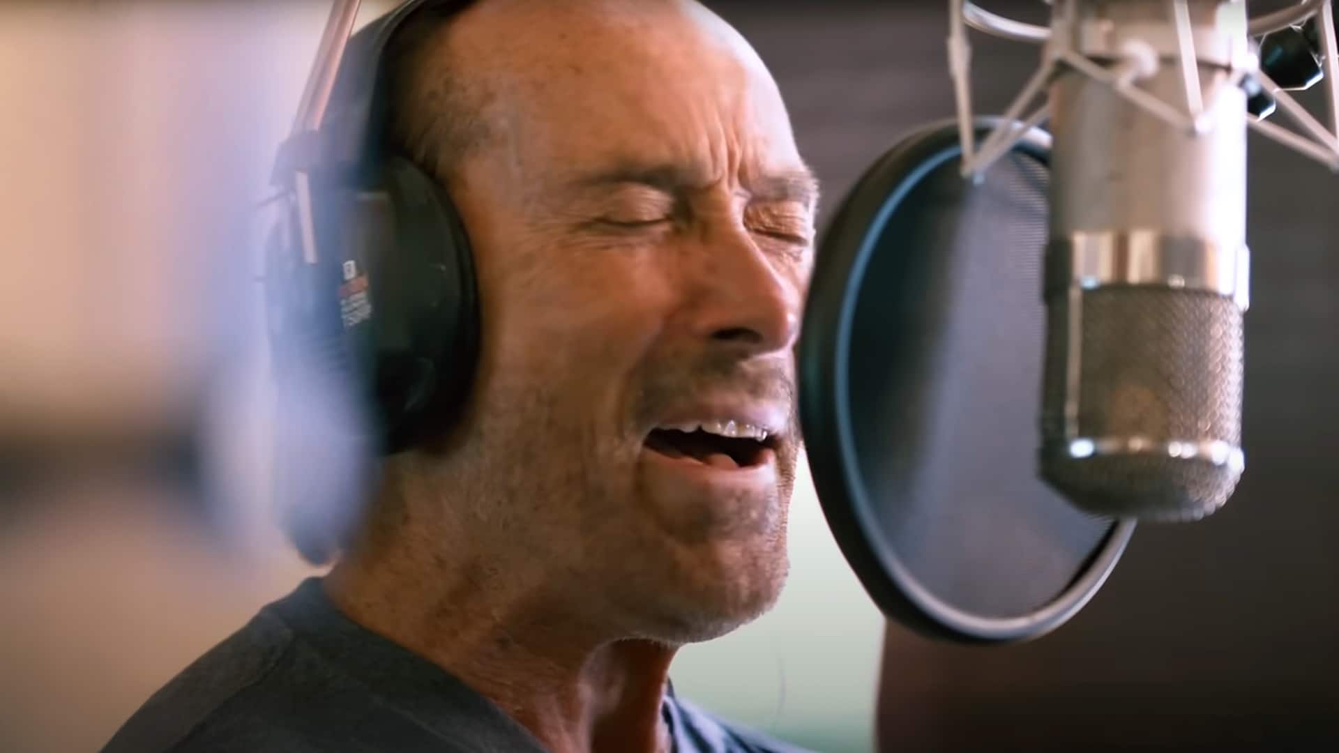 Lee Greenwood sings passionately in the studio while recording his new “God Bless the USA” version with U.S. Air Force soldiers.