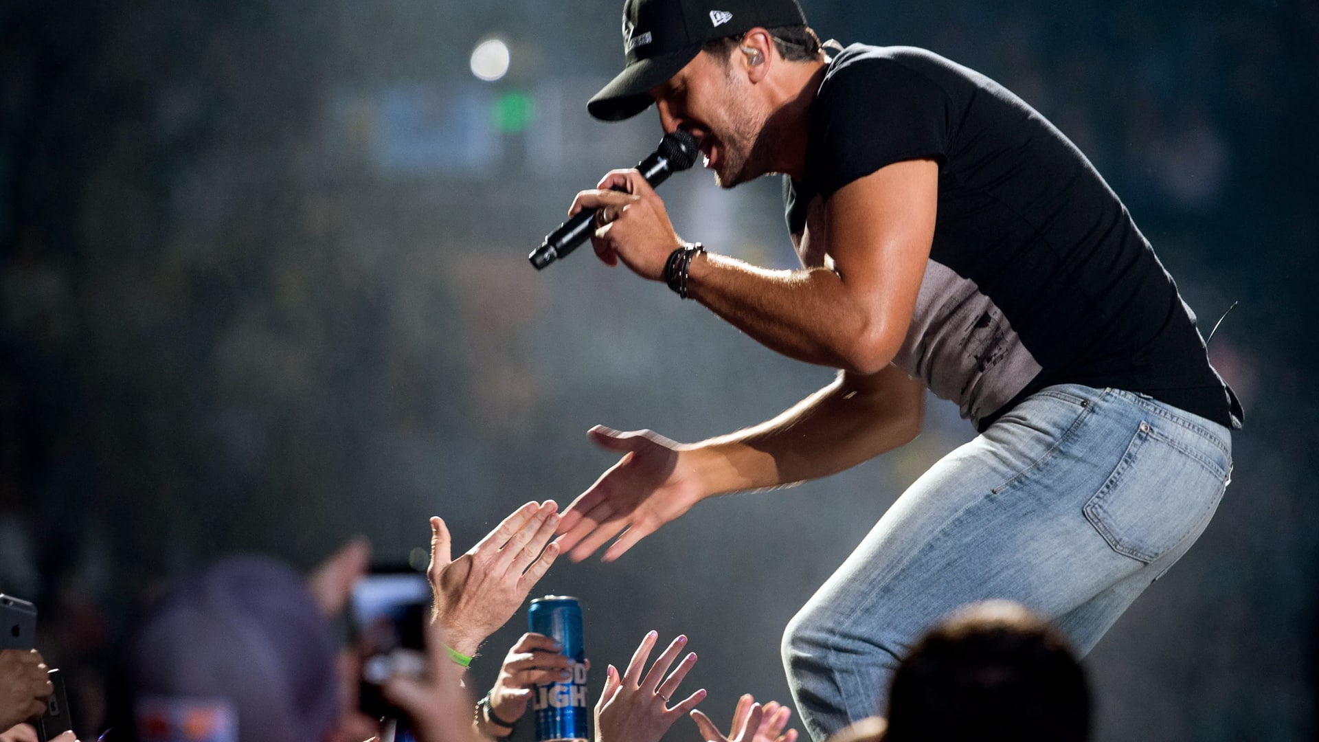 Luke Bryan worked the stage like a champ here, but after this week's illness, Eric Church is the one holding the mic now.