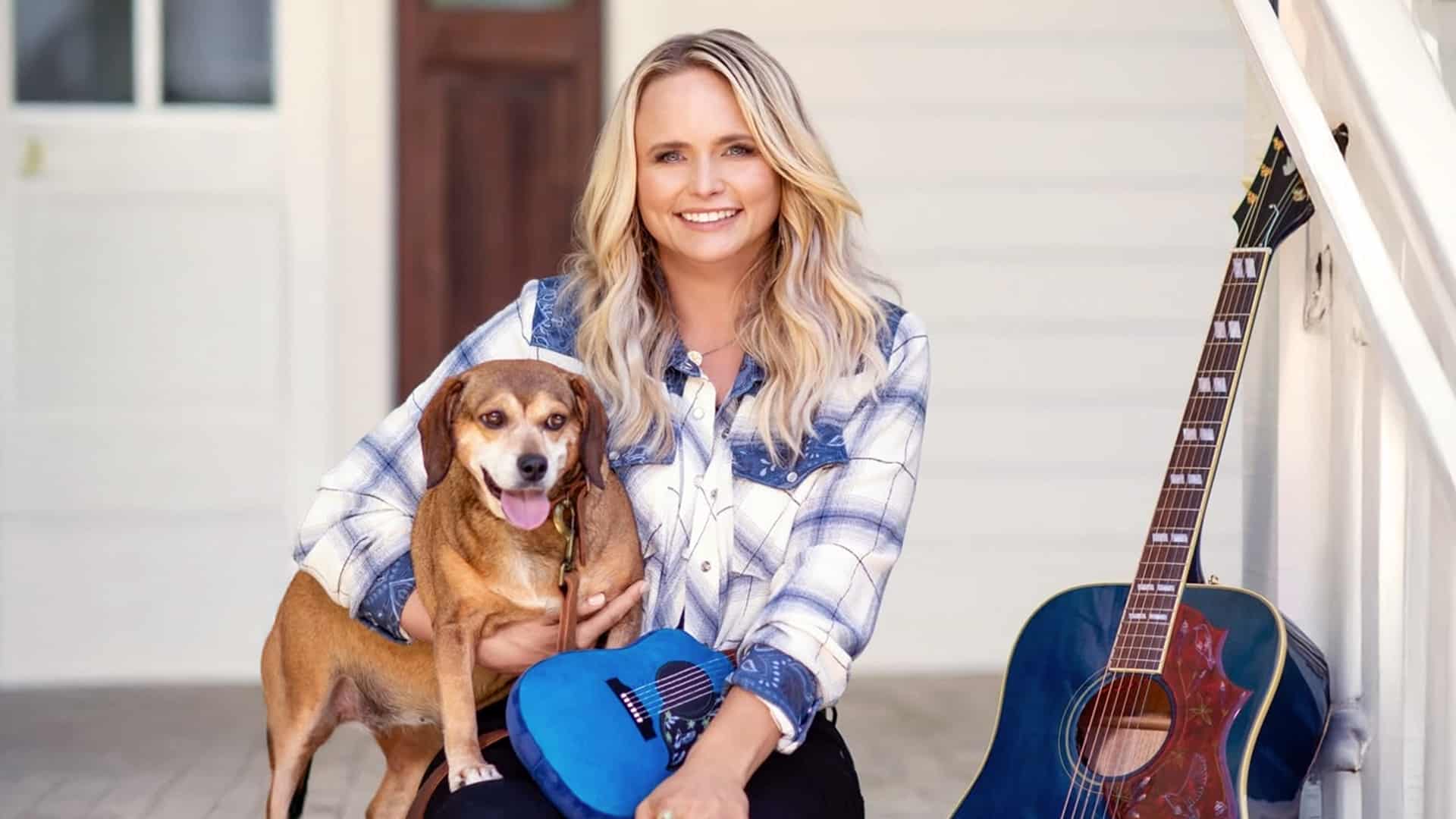 Miranda Lambert smiles on her porch with her dog and guitar, pictured not long before being honored as Texas State Musician for 2025.