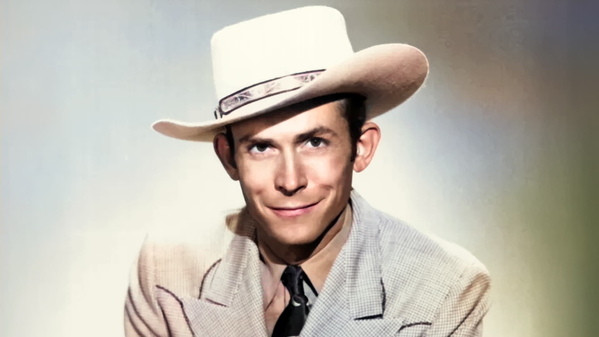 Hank Williams Sr. in a cowboy hat, still smiling like a legend Nashville could never cancel.