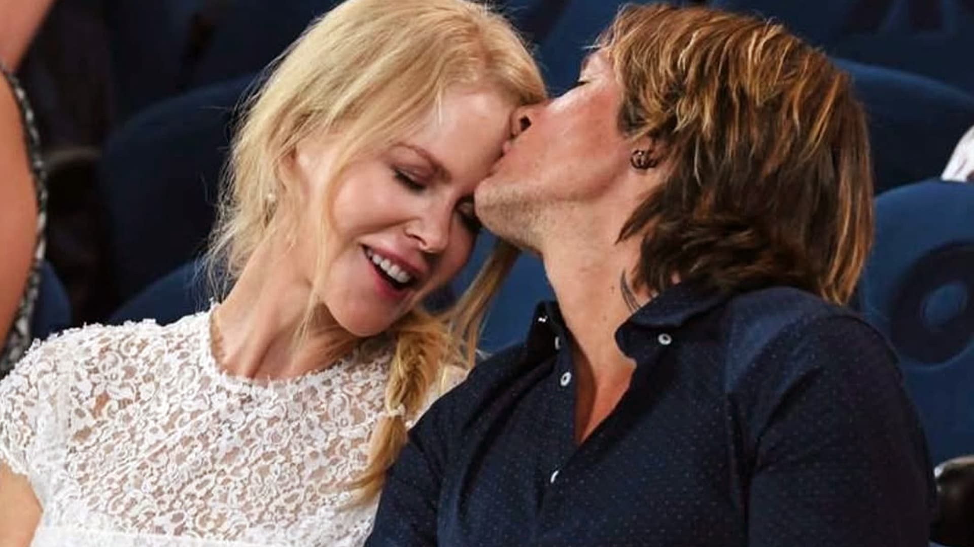 Keith Urban kisses Nicole Kidman on the forehead as they smile, celebrating 19 years of love and unshakable marriage.