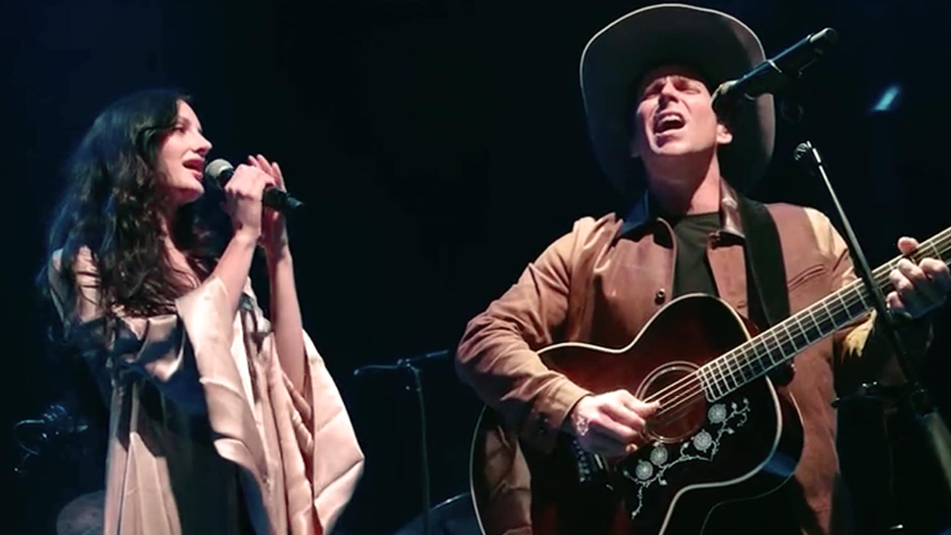 Audrey McGraw and Lukas Nelson perform live on stage, pictured during an earlier show before the official release of their long-awaited duet “Descent Into Love.”