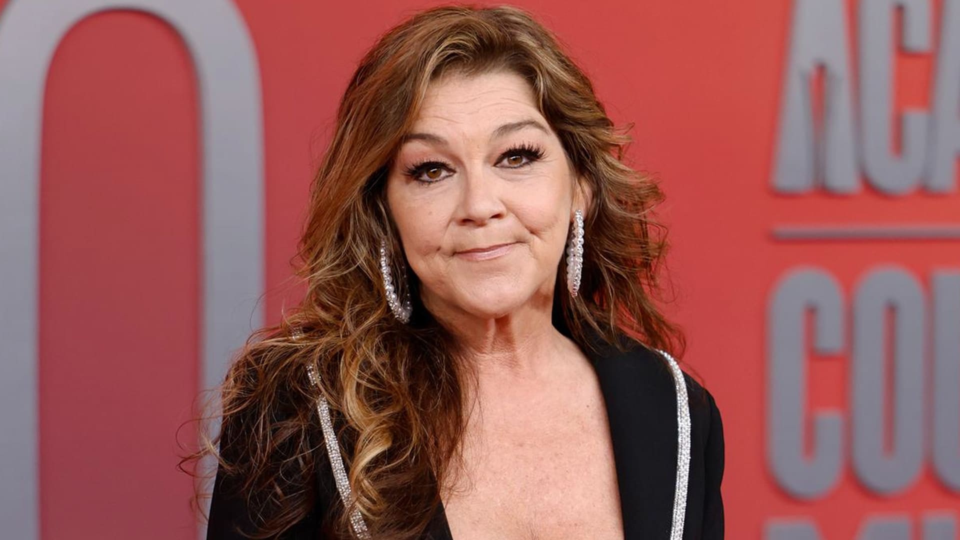 Gretchen Wilson flashes a smirk that says, “Y’all really thought I was gone?” The Redneck Woman might just be revving back up.