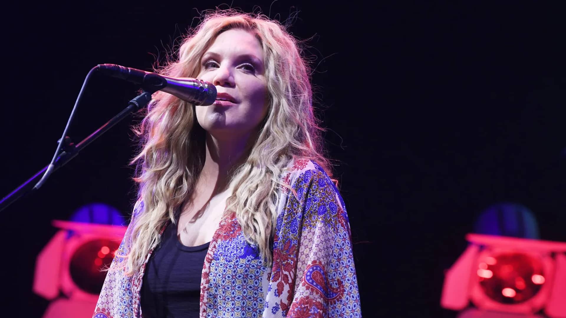 Alison Krauss performs under soft stage lights, her angelic voice delivering the timeless beauty of “When You Say Nothing at All”