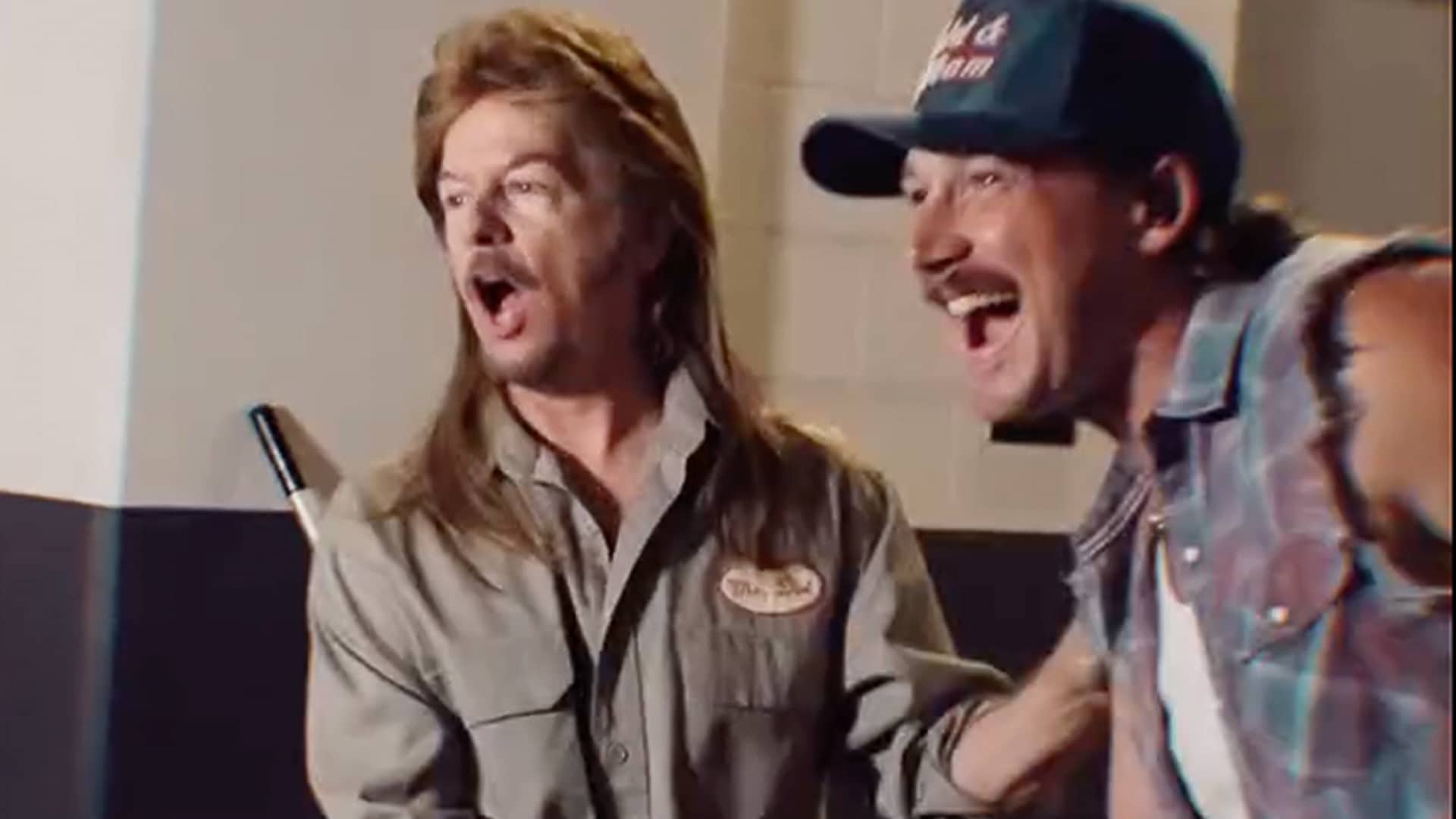 Morgan Wallen and David Spade dressed as Joe Dirt crack up backstage, mullet and mop in full effect, during a wild Arizona stop on the “I’m the Problem” tour.