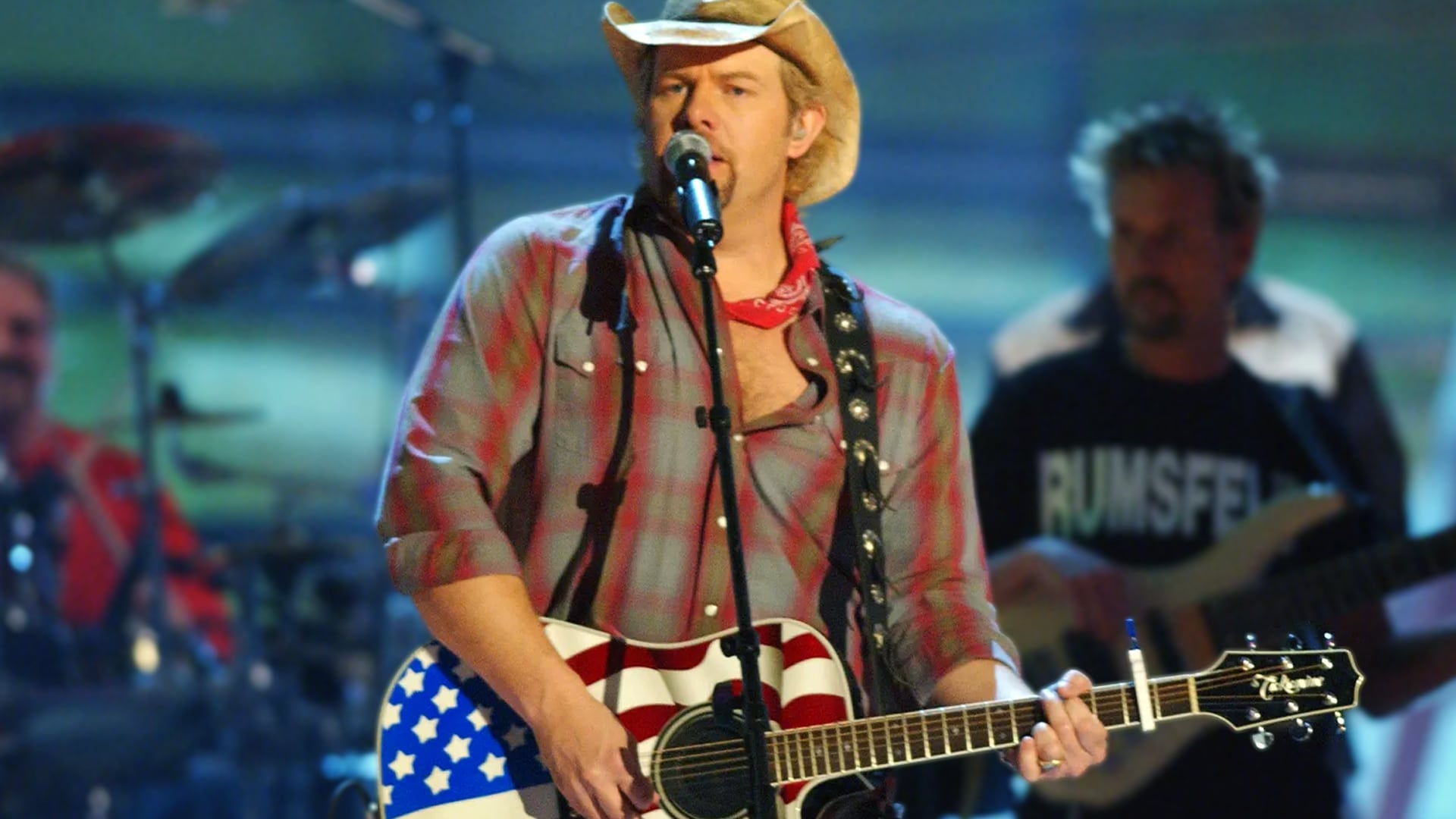 Toby Keith performs with his American flag guitar, the same patriotic spirit that fueled his song "Courtesy of the Red, White, and Blue."