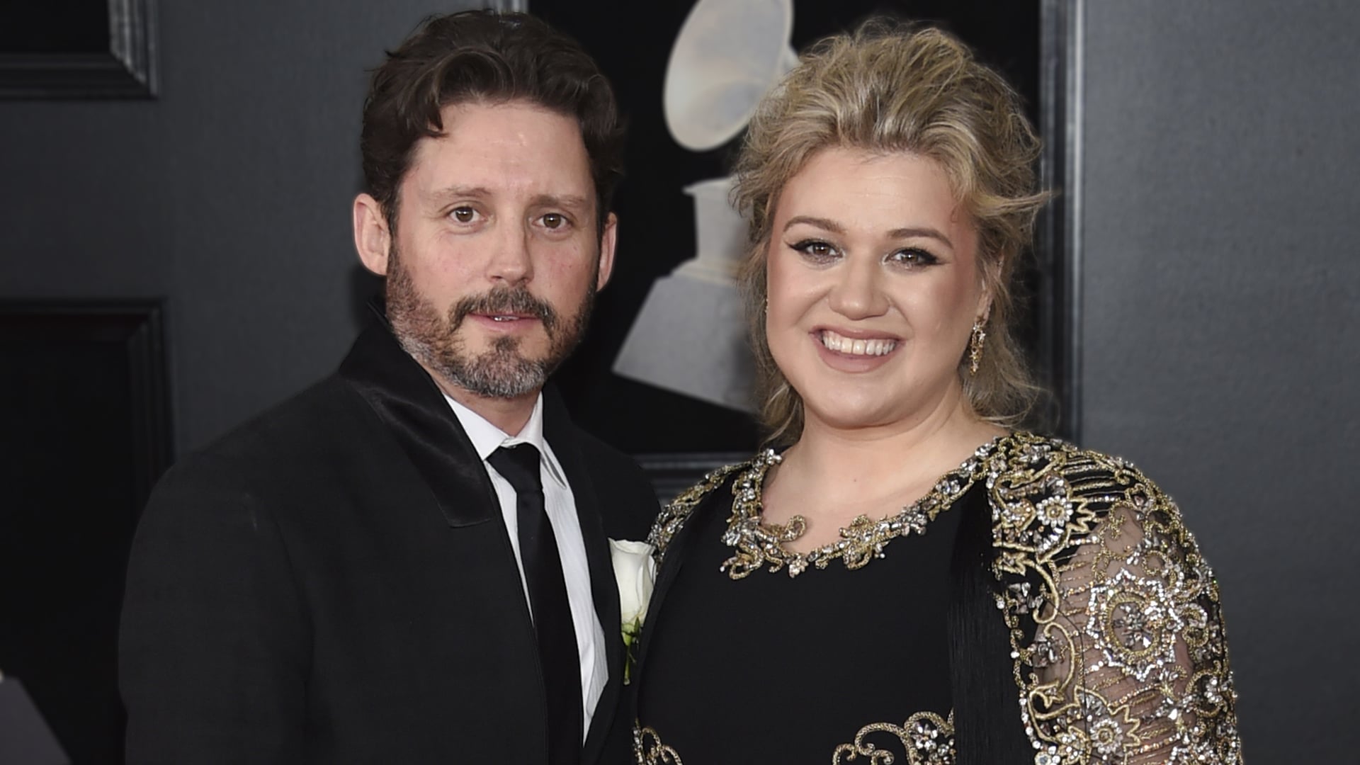 Brandon Blackstock and Kelly Clarkson pose together at a formal event, years before his passing from melanoma with seizures as a contributing factor.
