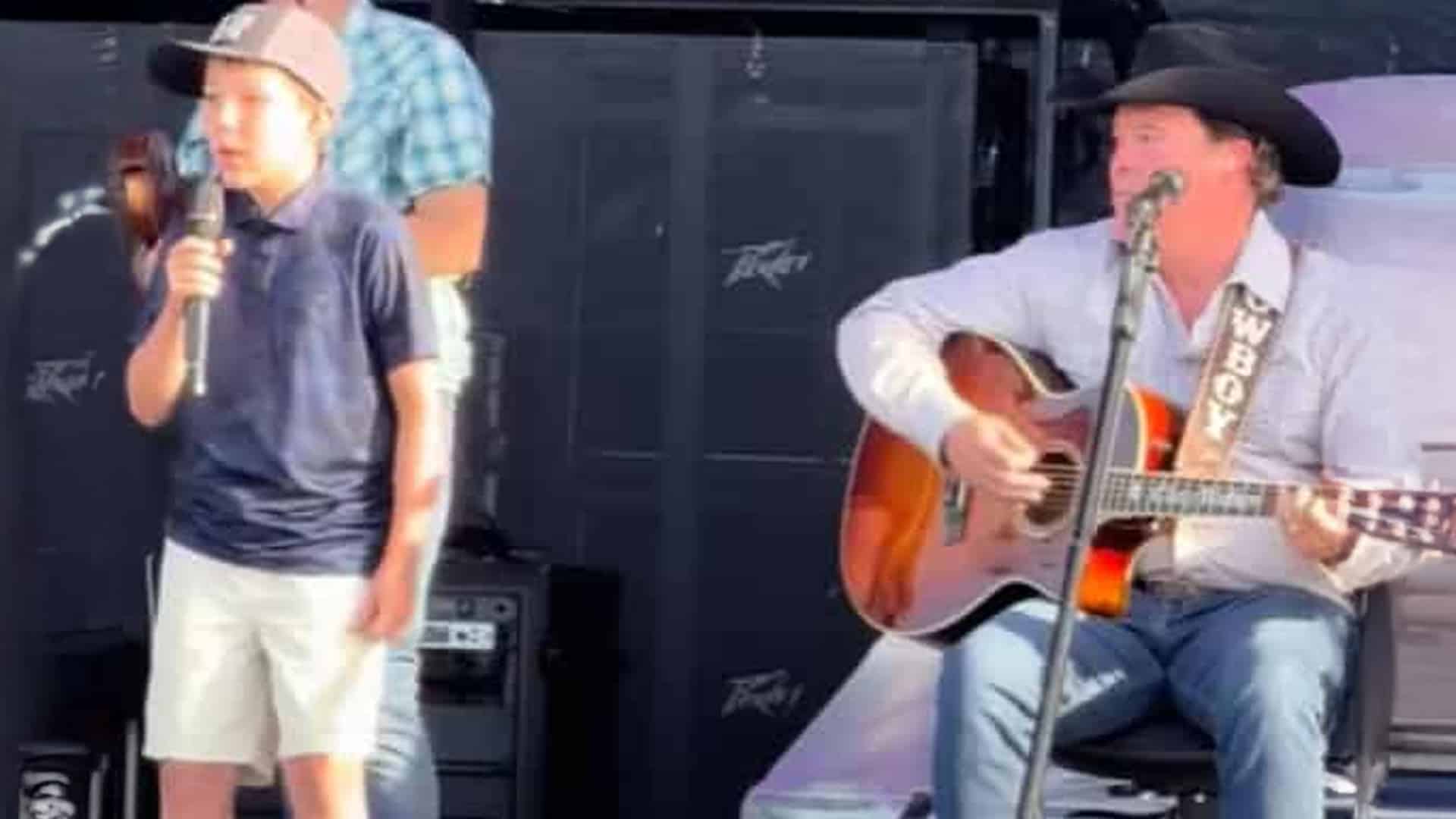 Clay Walker performs with his 12-year-old son Elijah, who surprised 30,000 fans with a show-stealing performance.