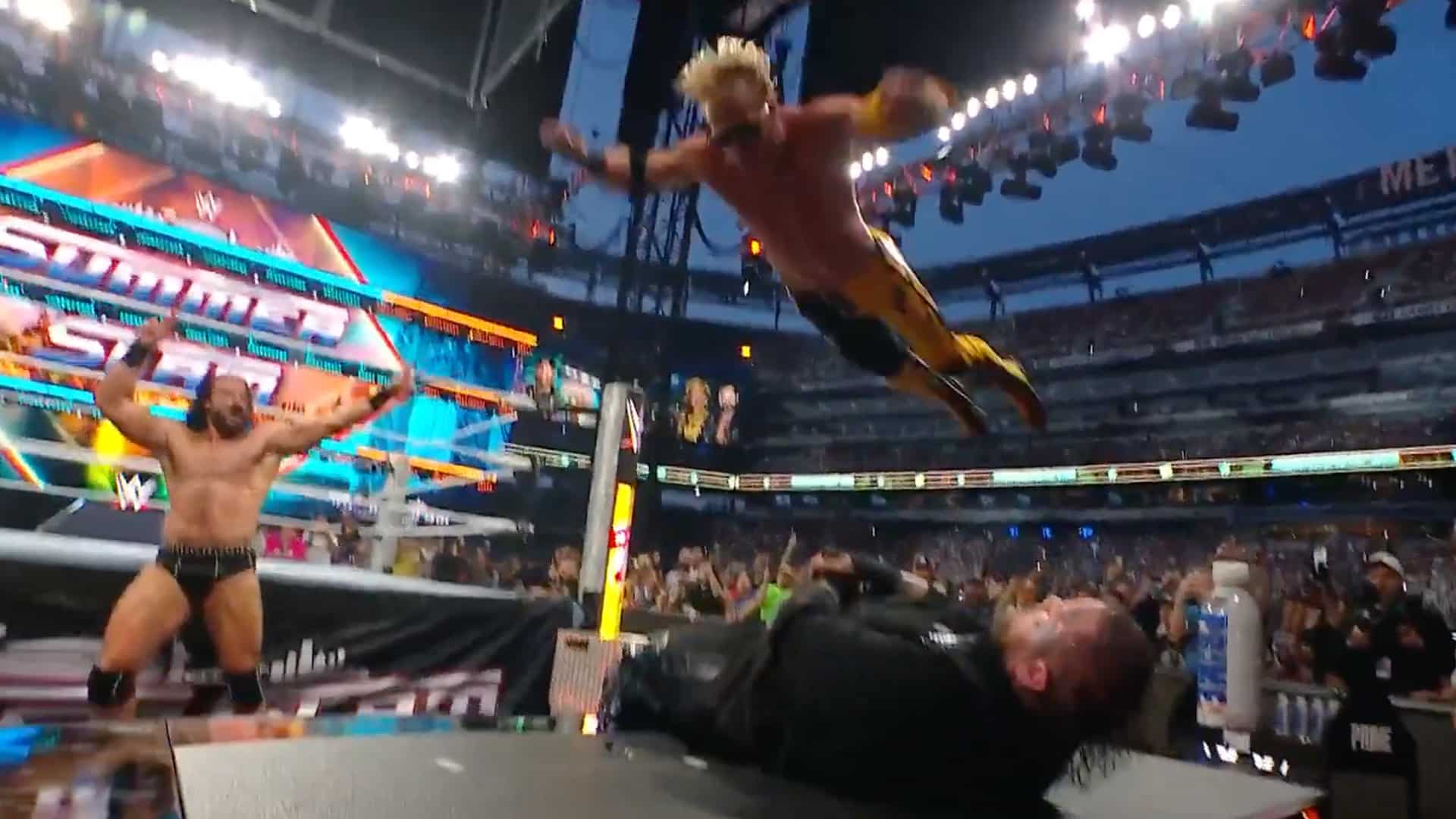 A wild WWE SummerSlam moment as Jelly Roll gets slammed through the announcer’s table during a chaotic tag team match.