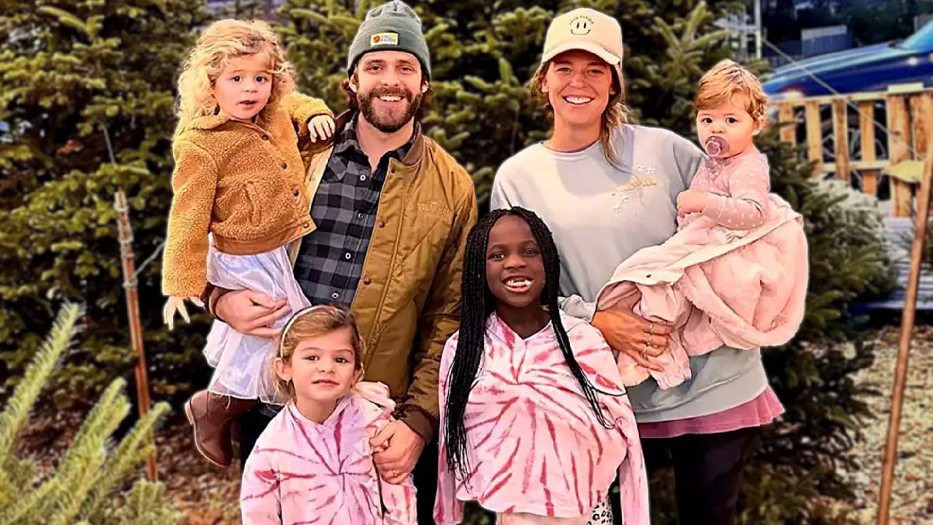 Country star Thomas Rhett poses with Lauren and their kids, celebrating family life as they prepare to welcome a fifth child.