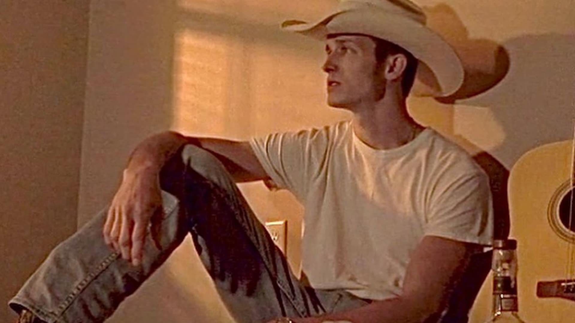 Spencer Hatcher, seen in an earlier reflective moment with his guitar nearby, now faces heartbreak after canceling shows following the tragic loss of his mother in a violent attack.