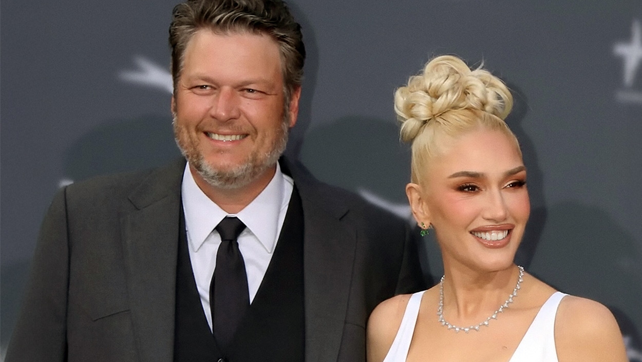 Blake Shelton and Gwen Stefani smiling on the red carpet, even as reports surface of Shelton seeking Keith Urban’s marriage advice.