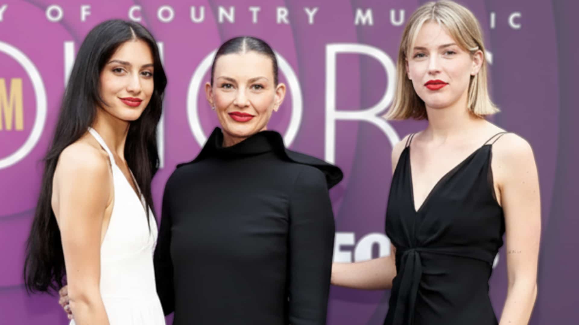 Faith Hill stands with her three daughters, who honored her 58th birthday by sharing throwback photos and messages online.