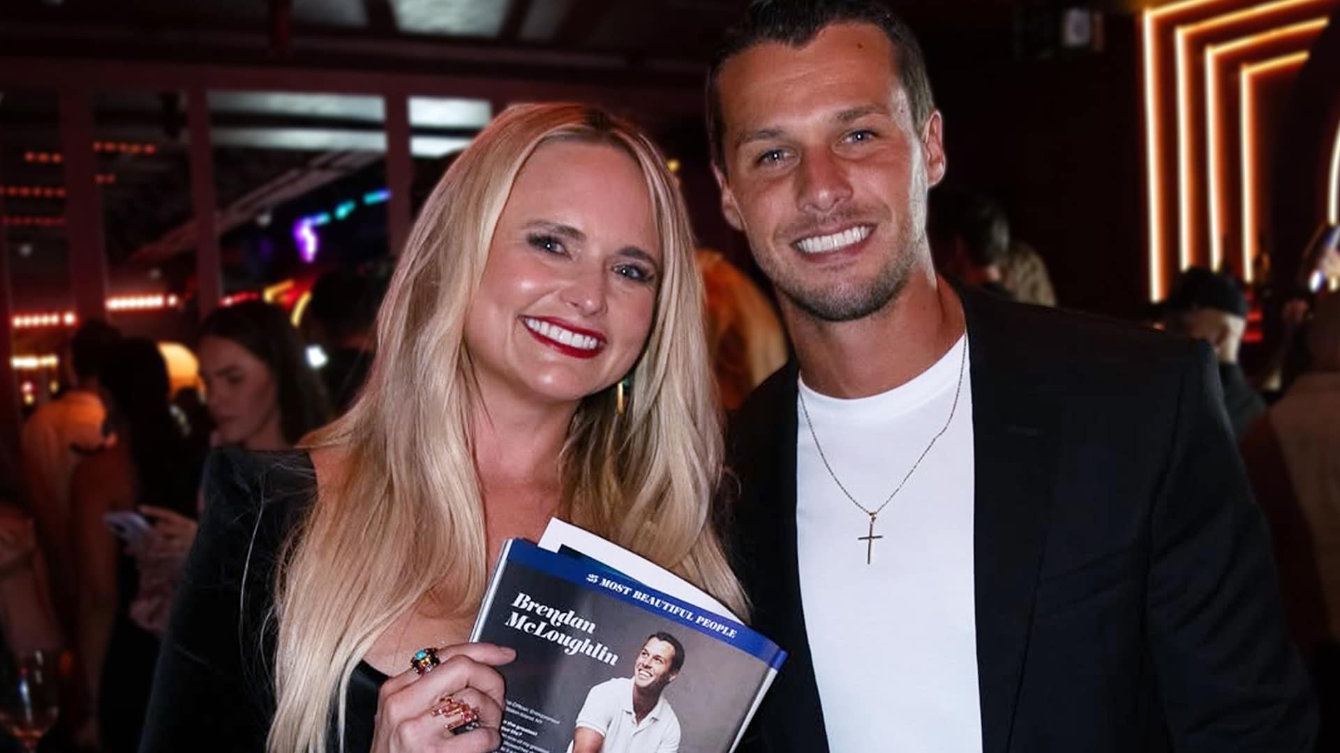 Miranda Lambert and husband Brendan McLoughlin smiling at an event, celebrating their strong marriage built on simple rituals.