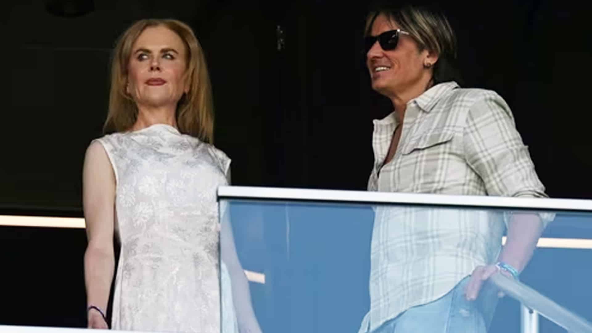 Nicole Kidman and Keith Urban stand together at an event before divorce filing ends their 19-year marriage.