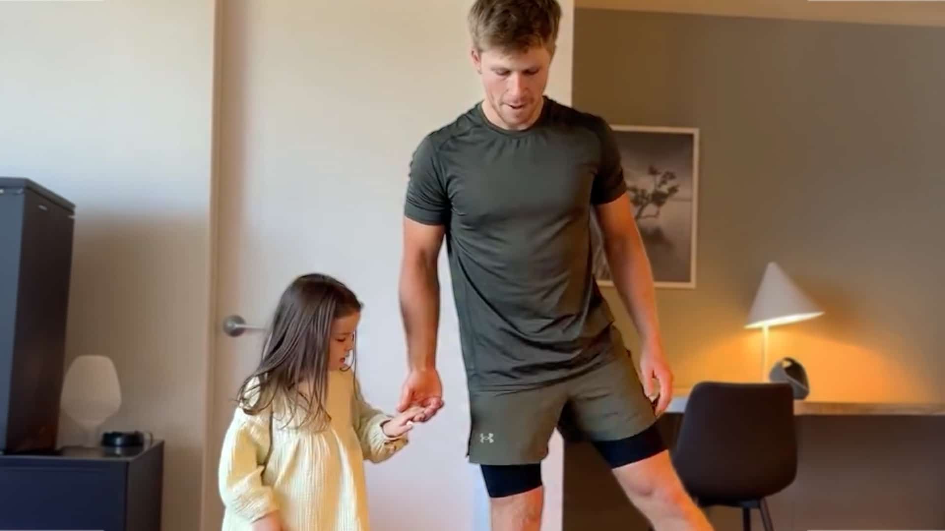 Robert Irwin holding his niece Grace’s hand while teaching her dance steps at home, proving his best-uncle status.