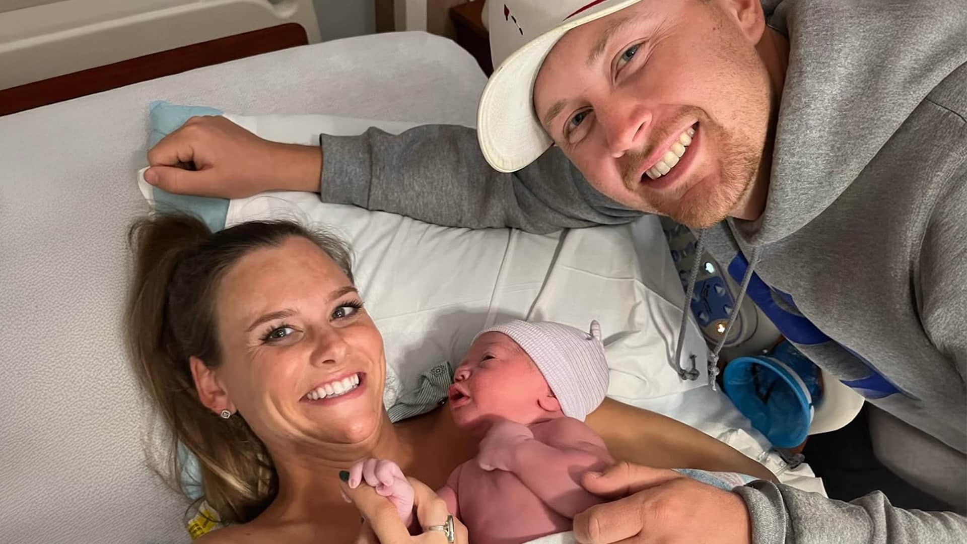 Scotty McCreery and wife Gabi smiling in the hospital as they welcome newborn son Oliver Cooke into the family.