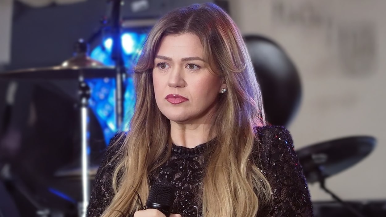 Kelly Clarkson in a black sequin outfit, looking reflective amid claims she unknowingly quarantined with Blackstock and his future partner.
