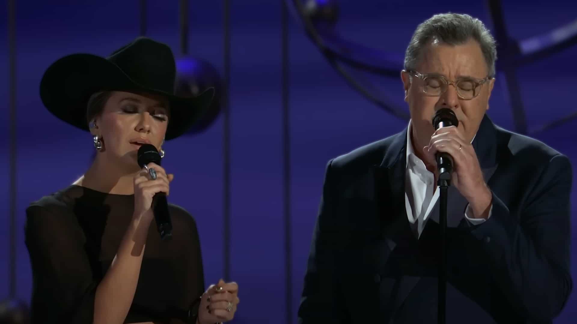 Vince Gill and Lainey Wilson perform an emotional duet of “Go Rest High on That Mountain” during the Emmys In Memoriam tribute.