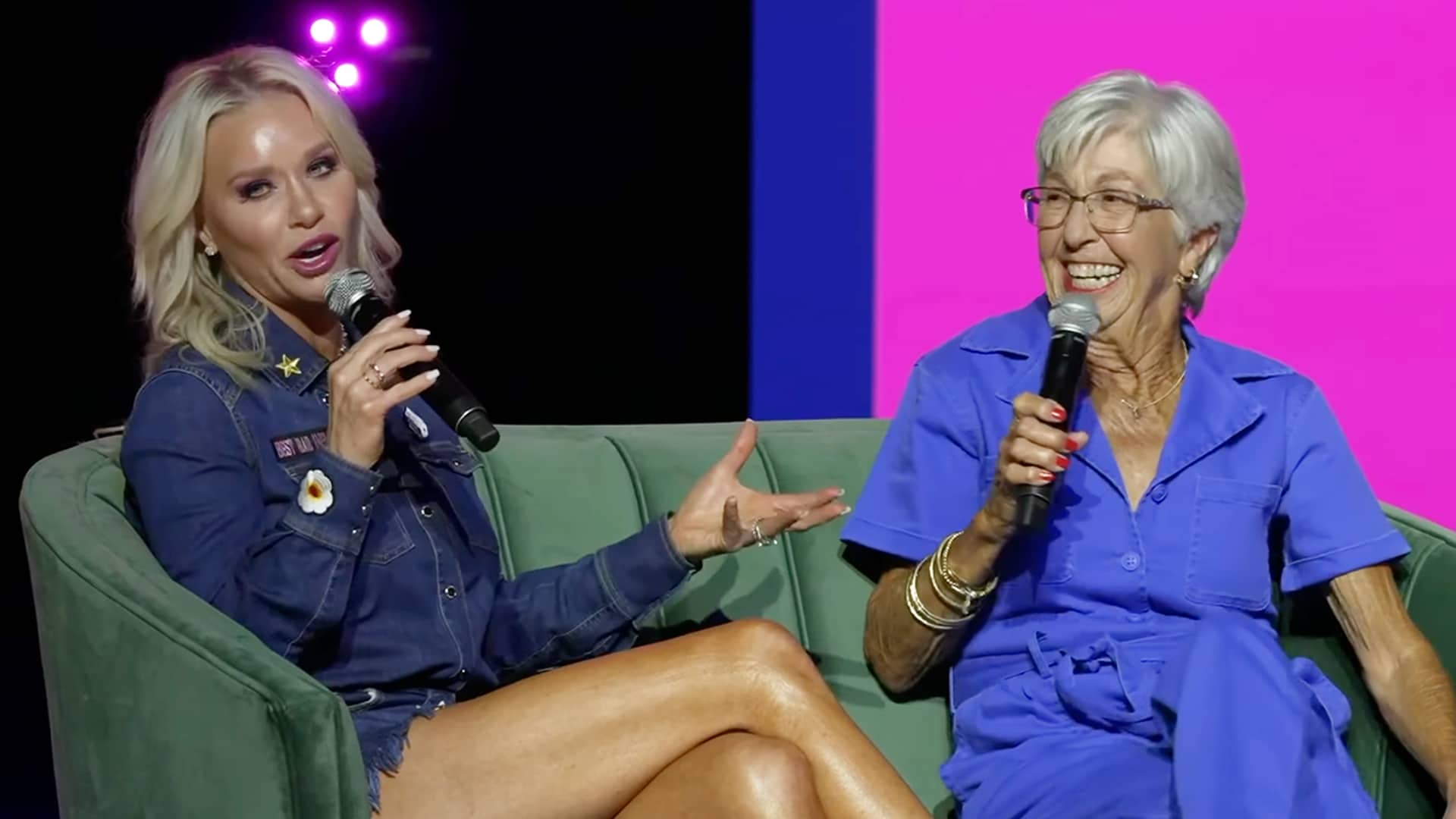 Caroline Bryan and LeClaire Bryan smiling with microphones during a live podcast, recounting the funny “tinkle” story that captures the Bryan family’s unfiltered humor.