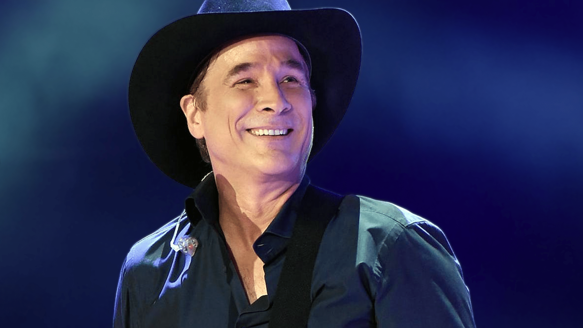 Clint Black smiling onstage in his black cowboy hat, ahead of being honored with the 2025 BMI Icon Award in Nashville.