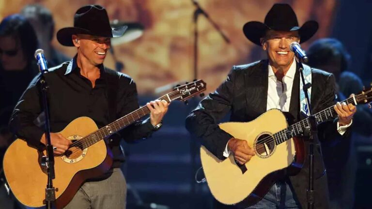 George Strait and Kenny Chesney performing together onstage with guitars, fueling fan hopes for a 2026 reunion tour of country legends.