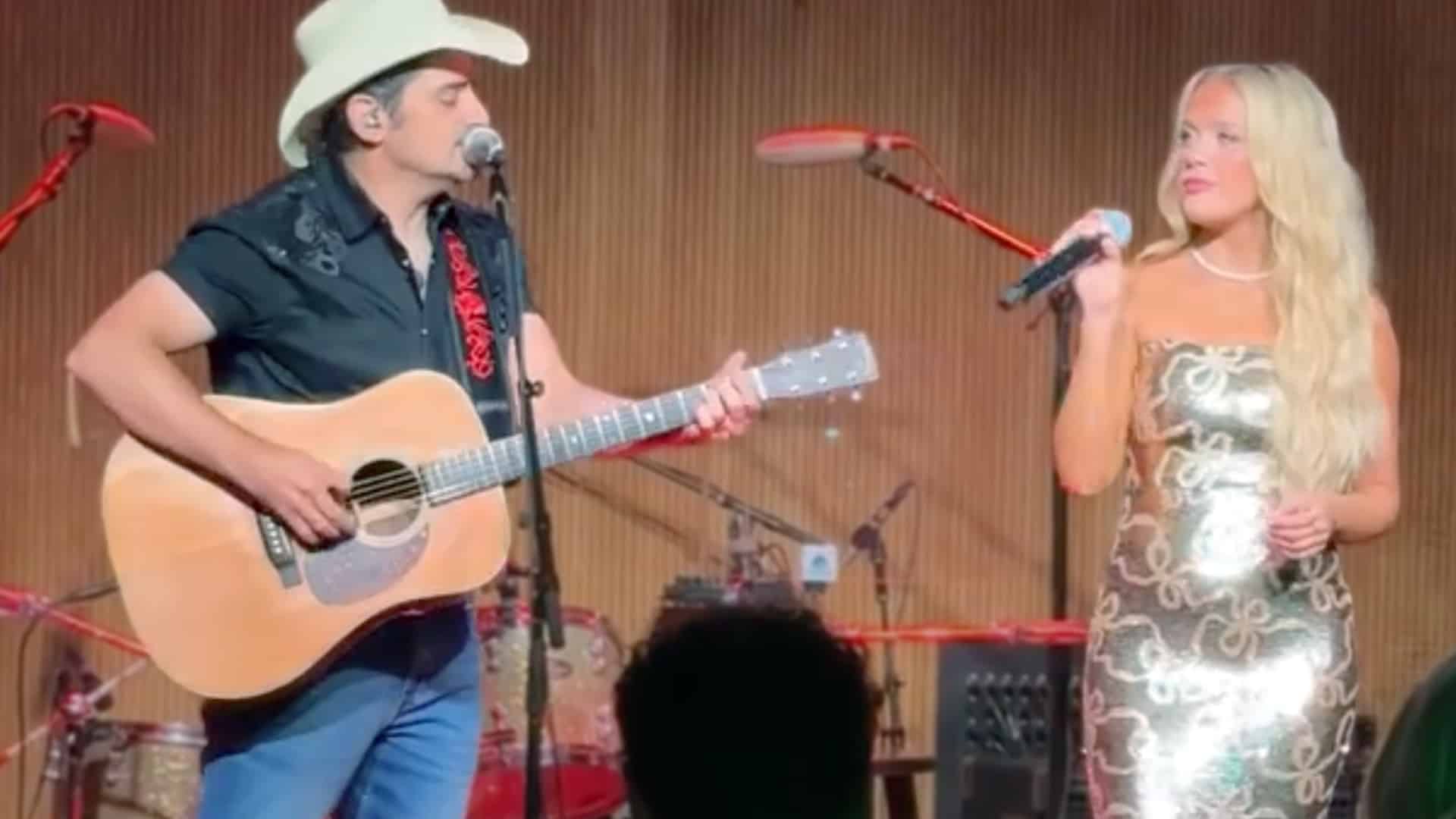 Brad Paisley and Megan Moroney performing “She’s Everything” together onstage, blending classic charm with fresh country sparkle at a Hallmark event.