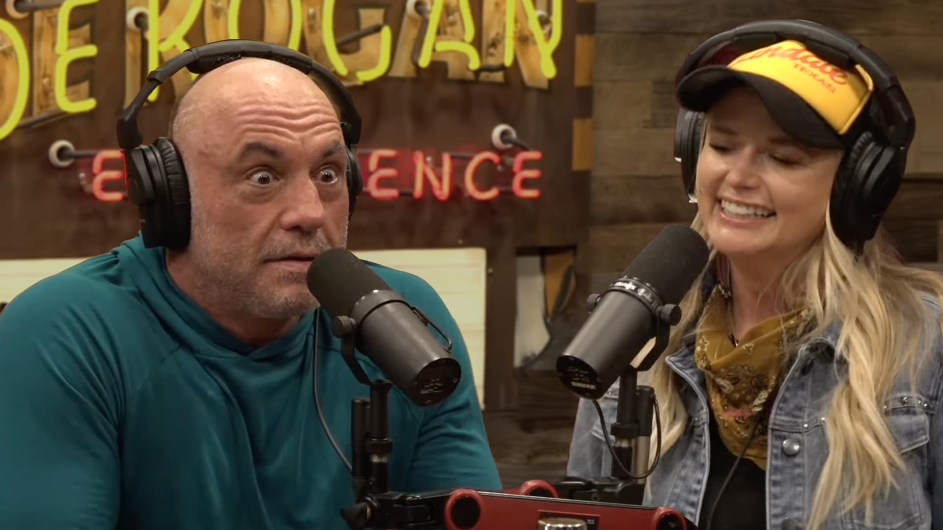 Joe Rogan and Miranda Lambert laughing during a podcast conversation, as she jokes that her only backstage tour demands are Cheetos and Tito’s.