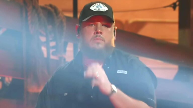 Luke Combs at 2025 CMA Awards wearing rare 1969 Omega watch originally gifted by Johnny Cash to Elvis Presley on his wrist in black Blue Otter cap and shirt showing off historic music artifact.