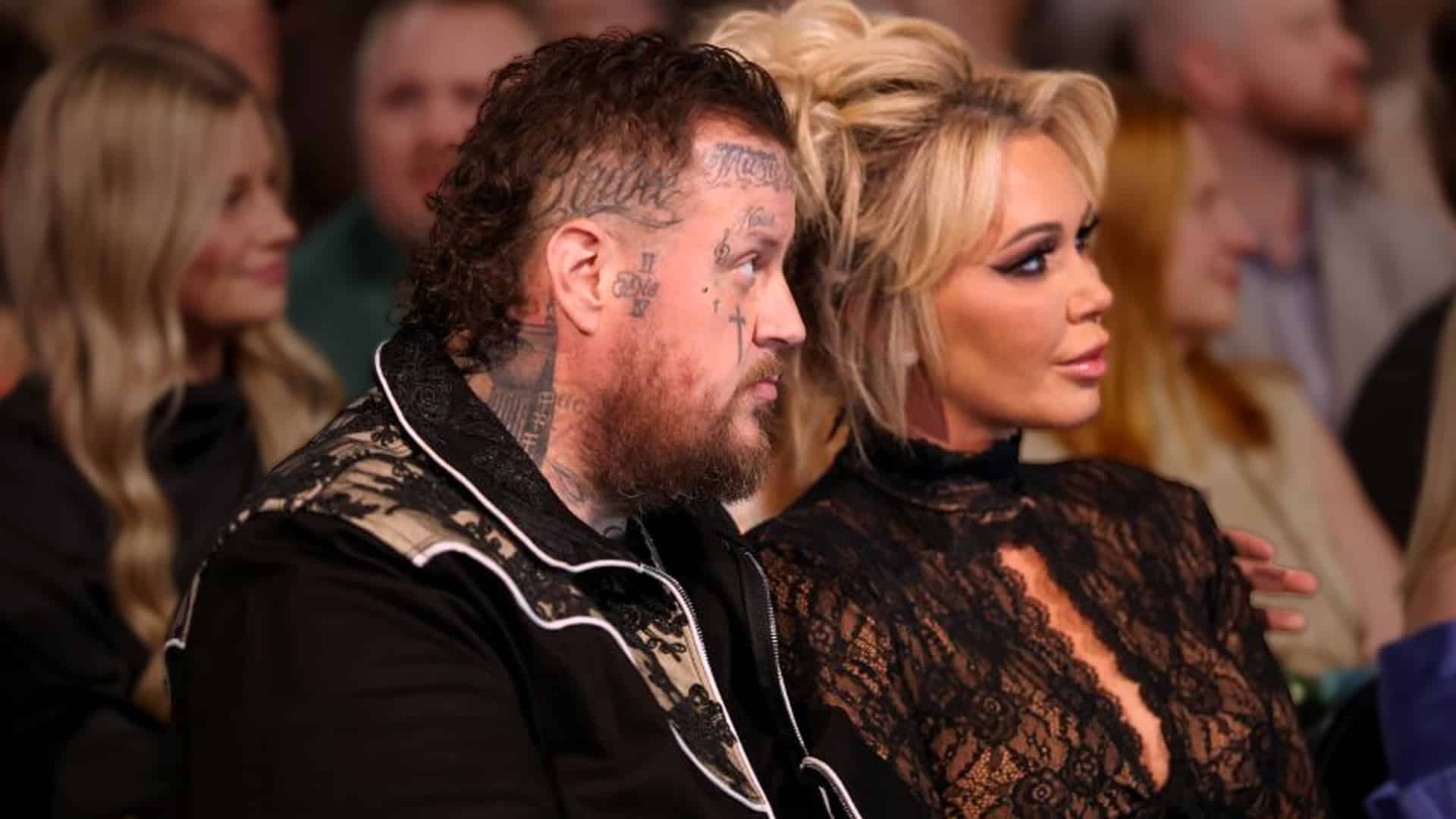 Bunnie Xo and Jelly Roll seated side by side, their united front reflecting the strength and faith behind her honest talk about infertility.