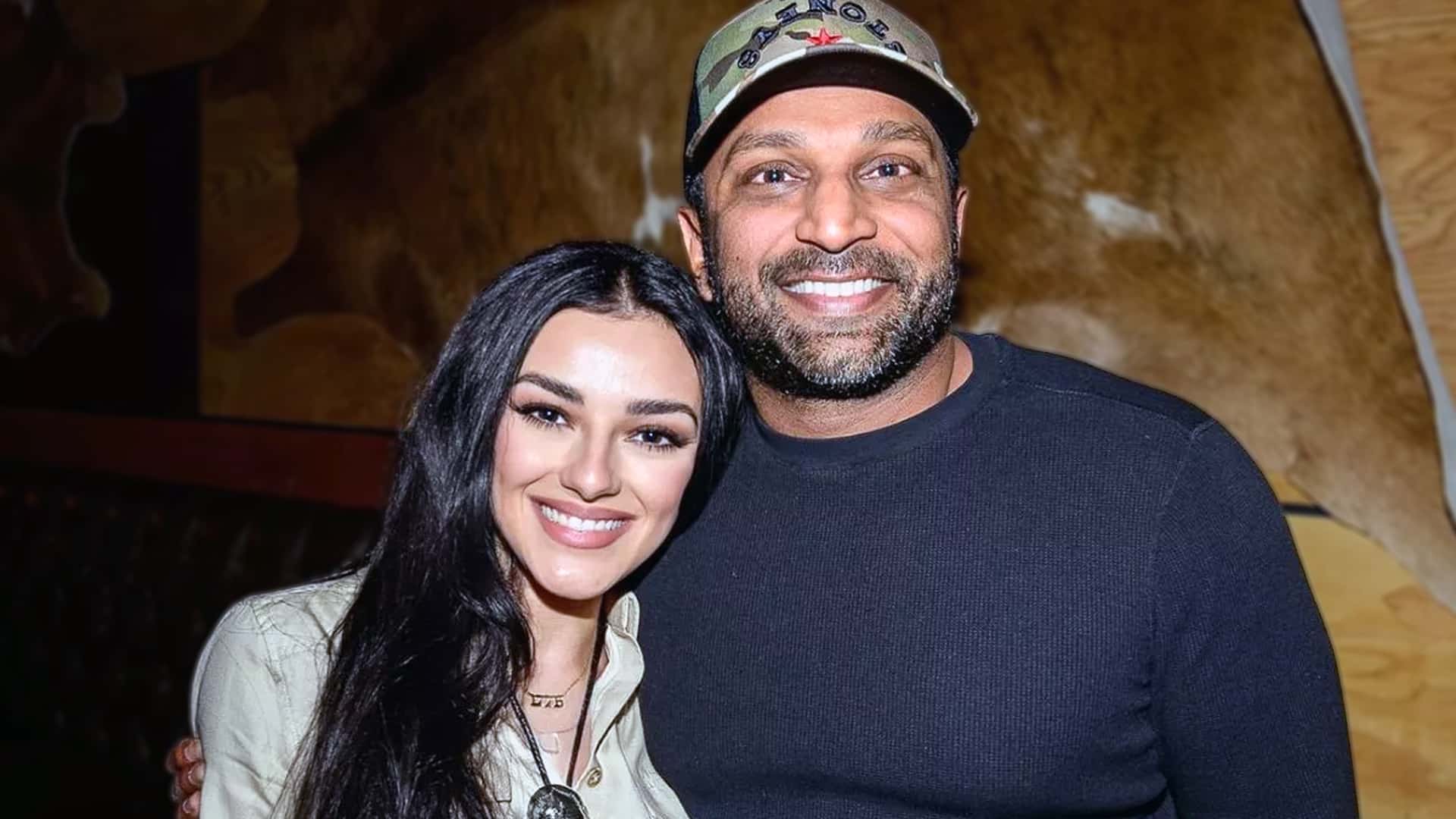 FBI Director Kash Patel and Alexis Wilkins standing arm in arm with easy grins, reflecting the blend of Nashville roots and D.C. momentum shaping their low-key relationship.