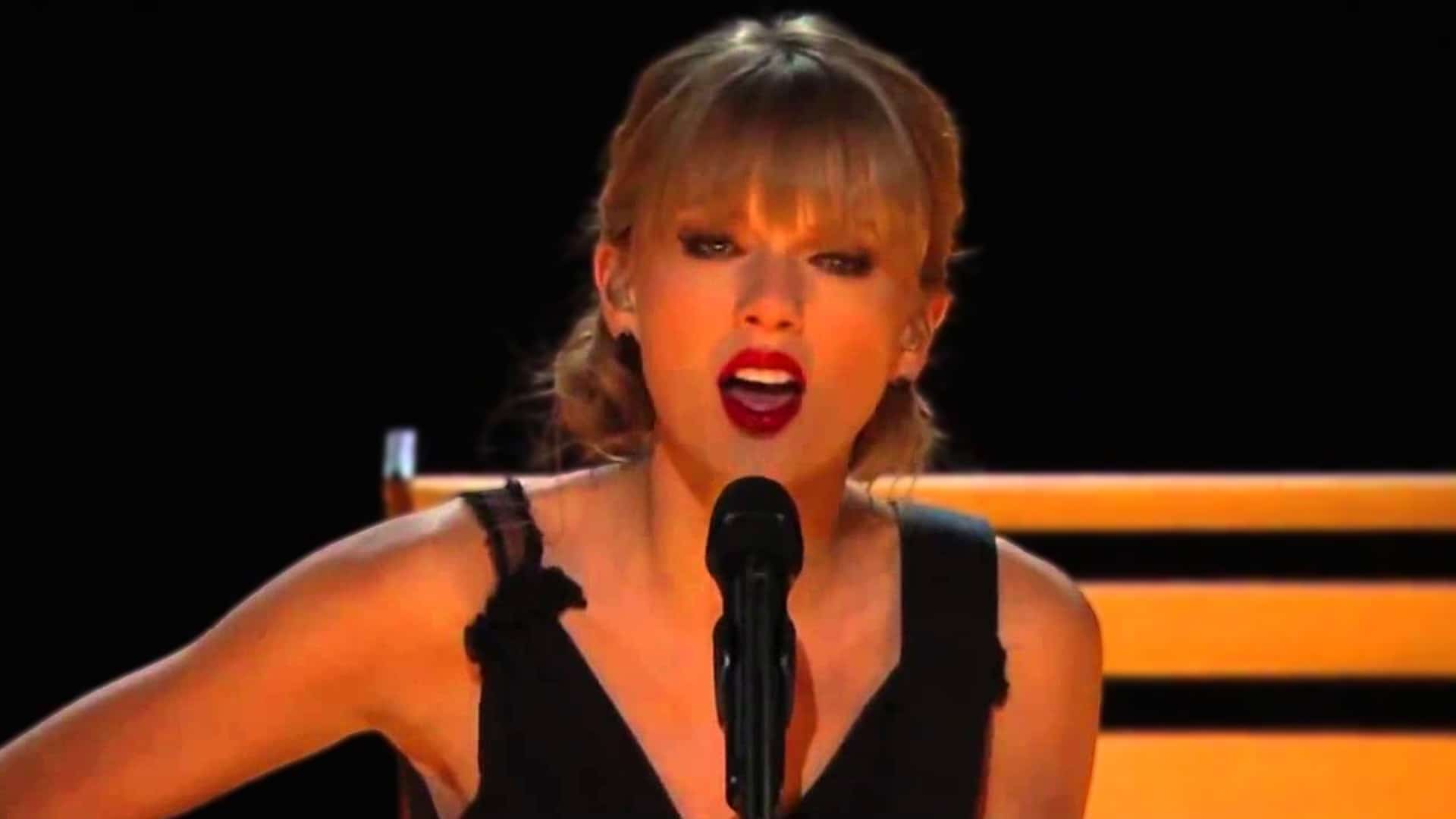 Taylor Swift singing emotional acoustic Red with Vince Gill on guitar and Alison Krauss on harmony at 2013 CMA Awards in black dress raw performance that won over traditional country fans.