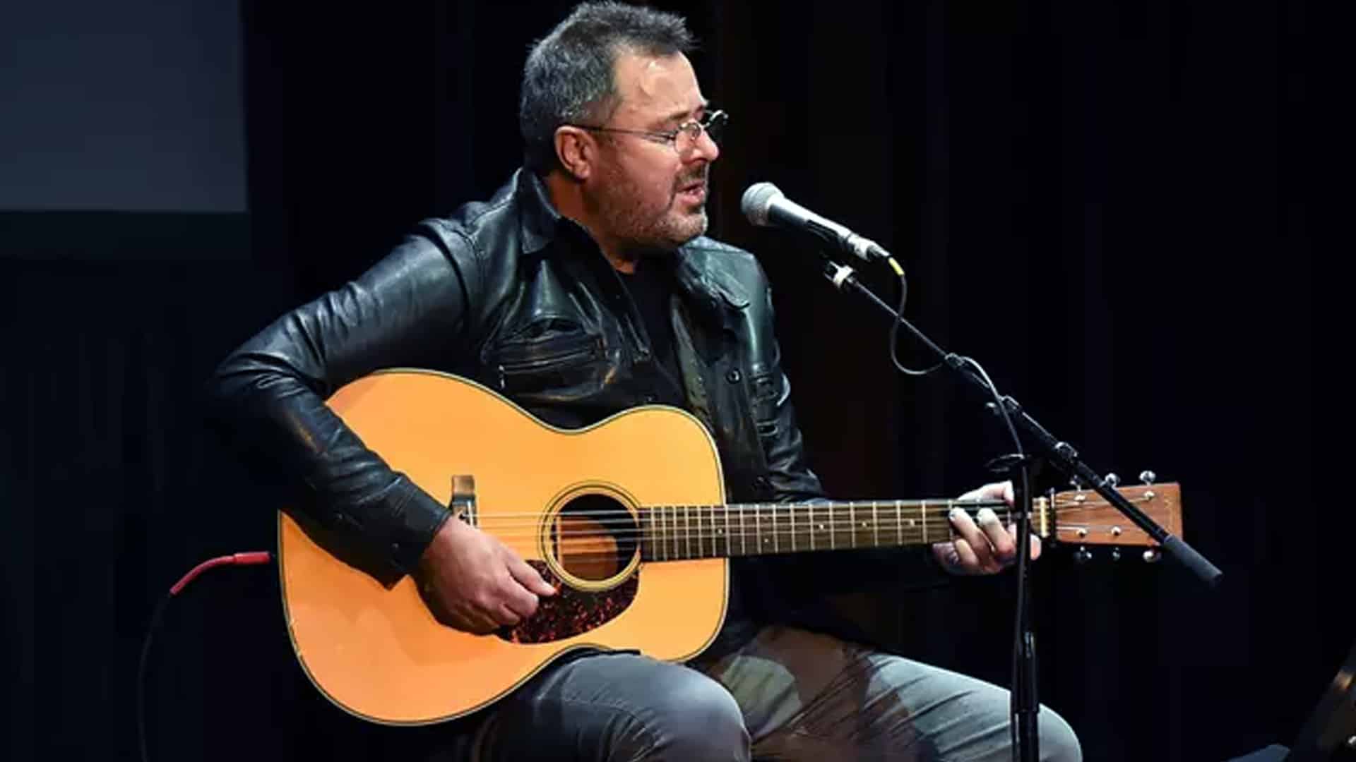 Vince Gill performing with his acoustic guitar, a fitting image as he’s honored with the 2025 Willie Nelson Lifetime Achievement Award.
